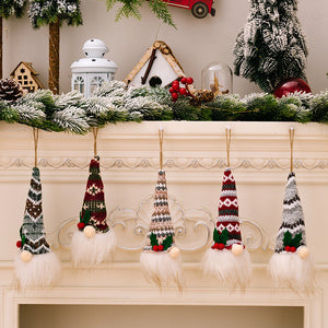 Illuminated gnome ornaments with knitted hats in various patterns and white beards.
