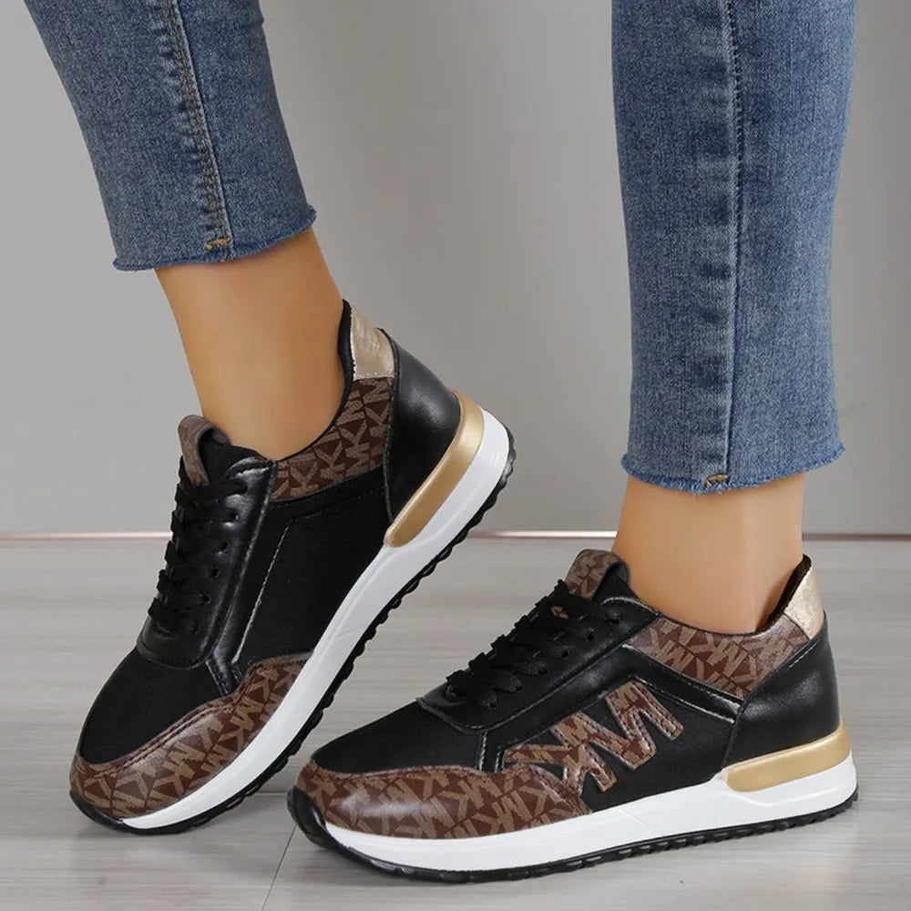 Logo monogrammed runner sneakers in black with brown monogram detail and gold accents.
