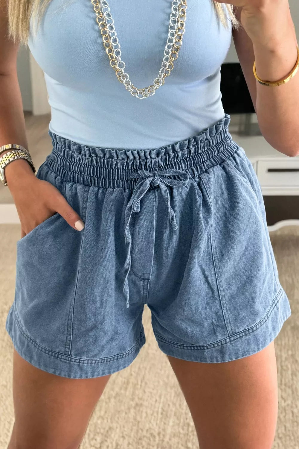 Blue denim shorts with smocked waist and drawstring, casual cotton shorts with pockets.