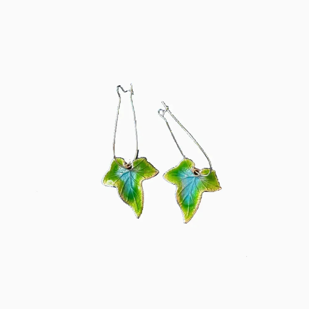 Verdant enamel ivy drop earrings in green and blue with gold trim.