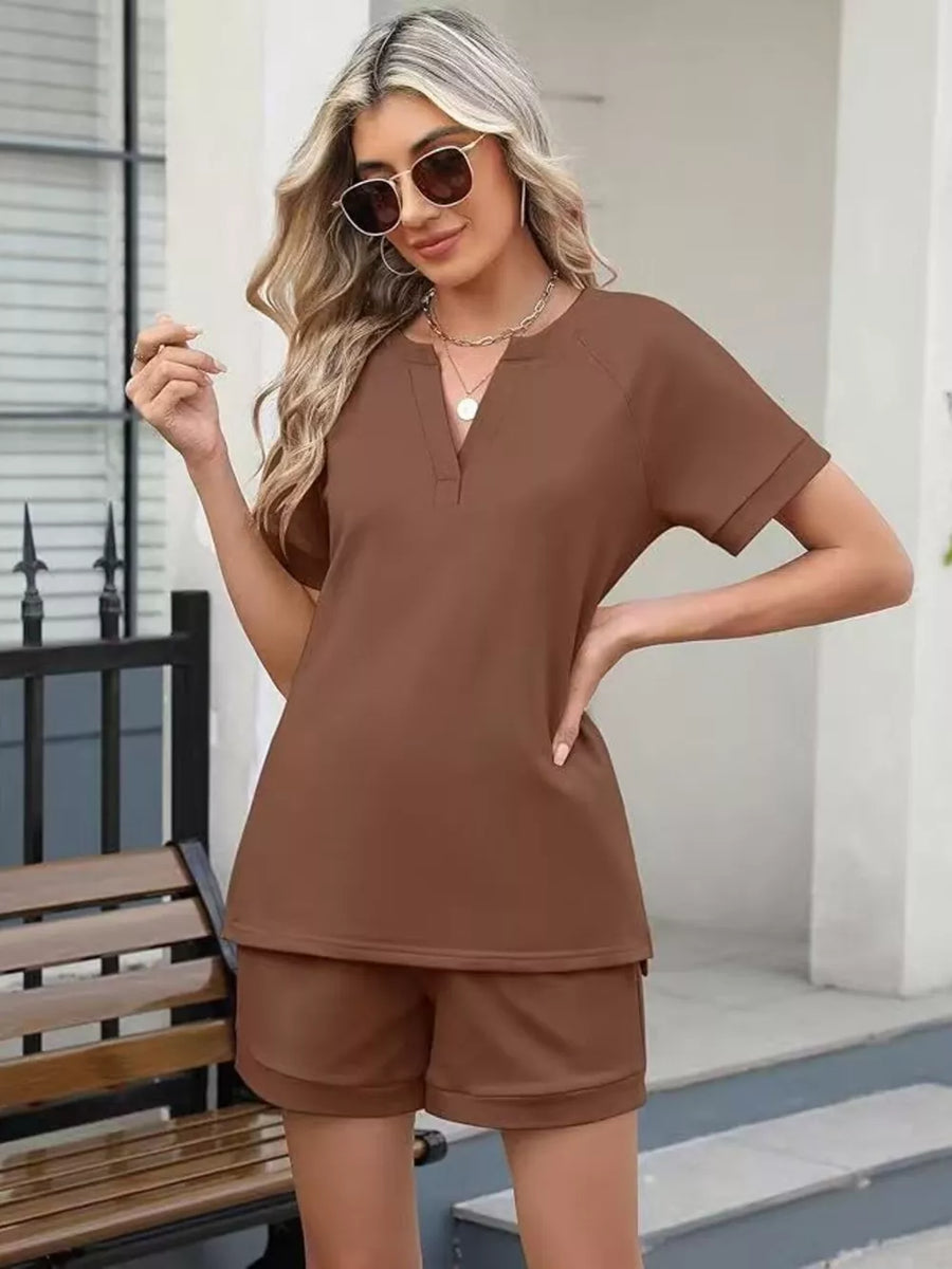 Brown relaxed two-piece set with v-neck top and shorts.