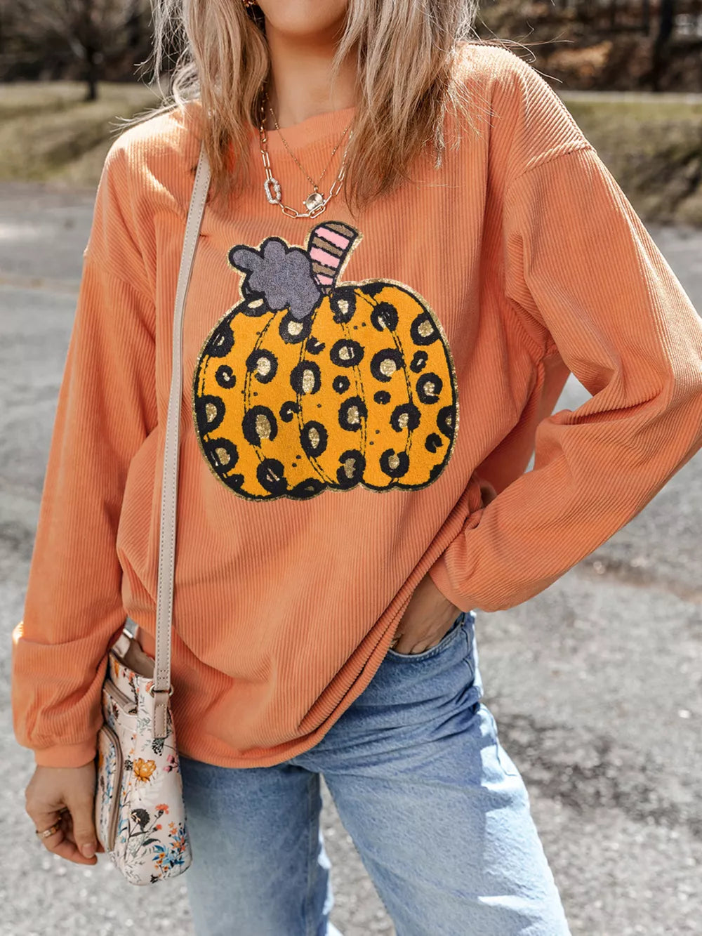 orange sweatshirt with leopard and crew neck