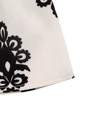 Loungewear shorts in apricot with black medallion print and smocked waist detail.