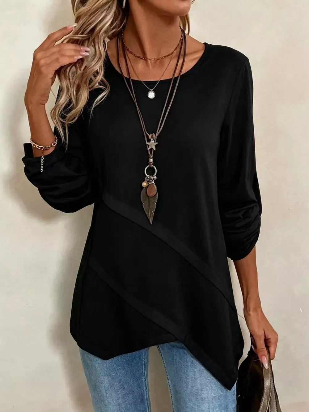 white blouse with seam details and long sleeve