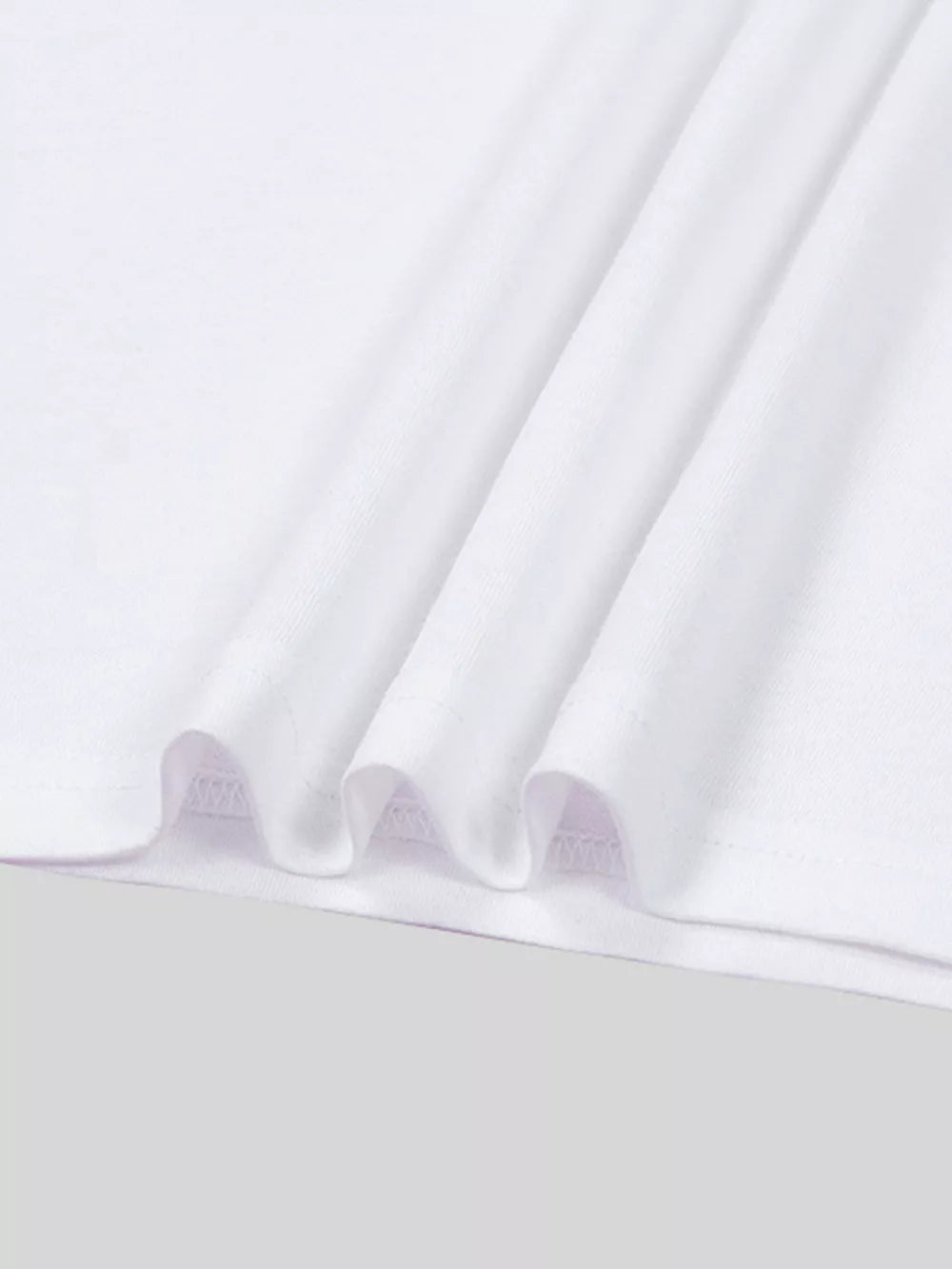 White t-shirt with soft cotton fabric and subtle pleats.