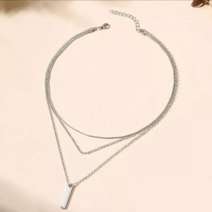 Silver layered bar pendant necklace with delicate chains.