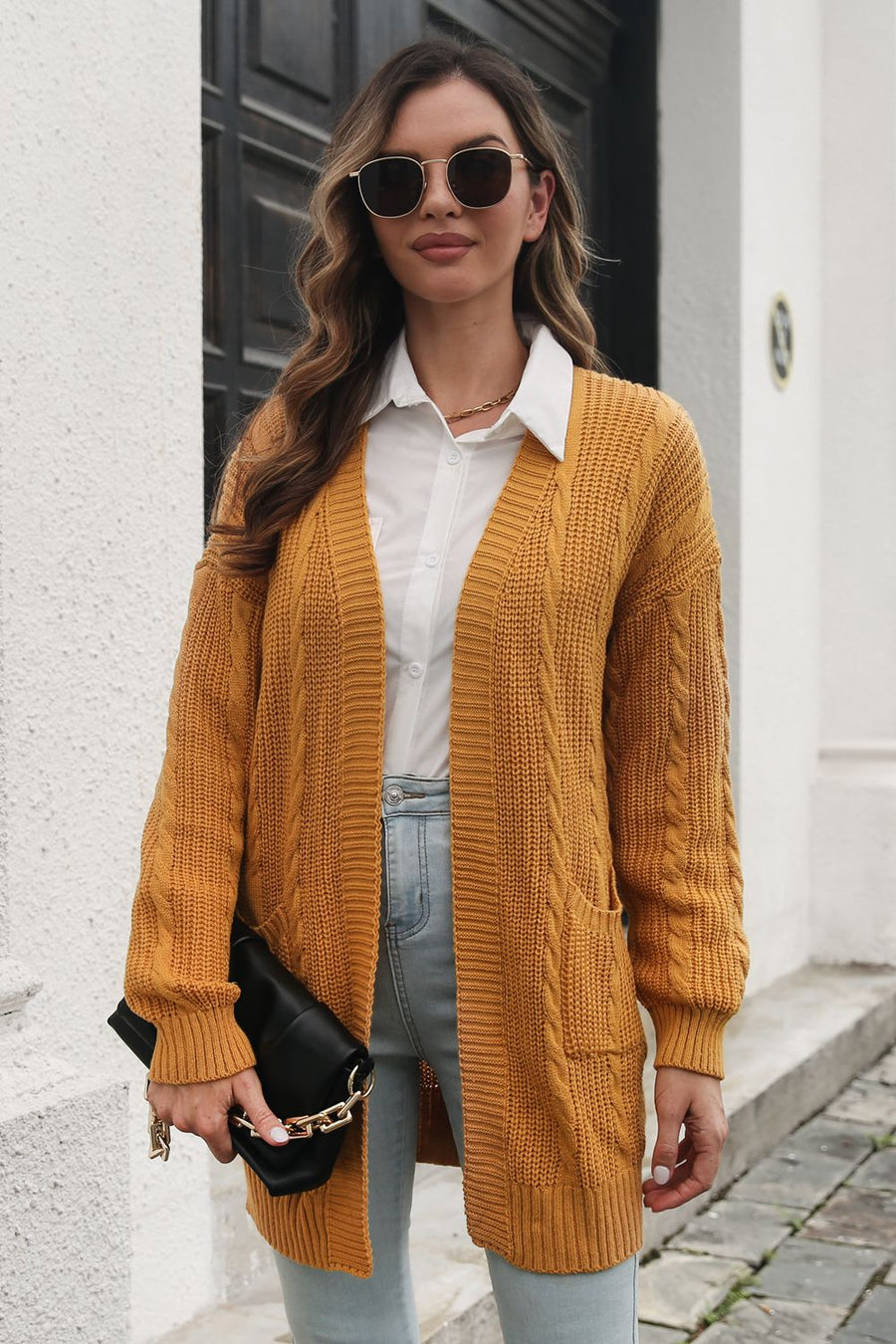 Mustard cable knit longline cardigan with pockets, acrylic, open front, long sleeves.
