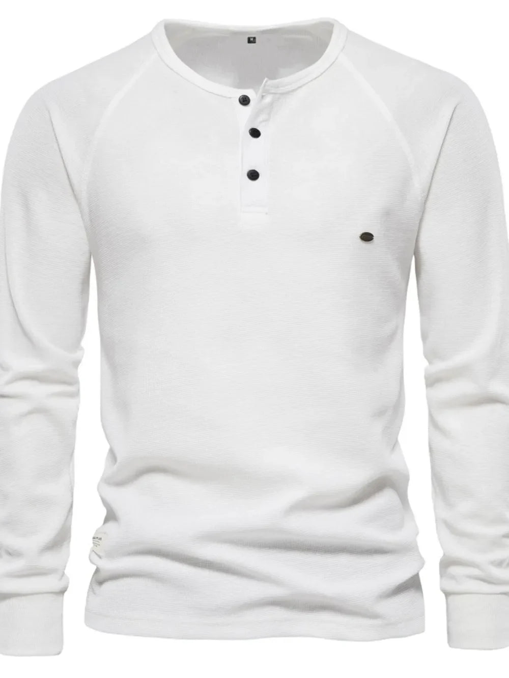 White waffle knit henley shirt with raglan sleeves and black buttons.