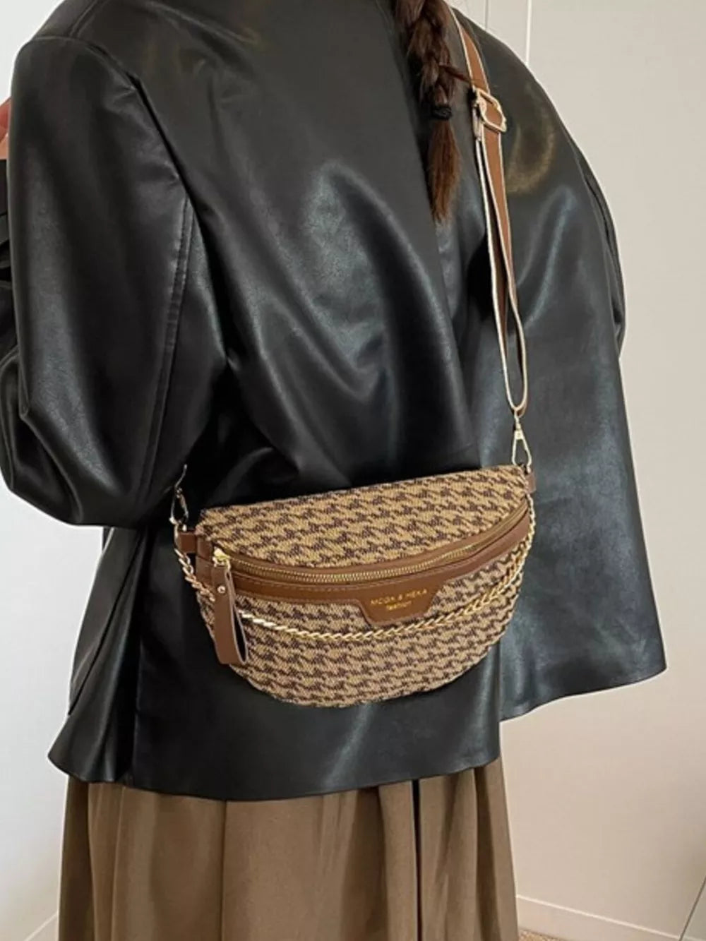 Houndstooth mini crossbody bag with chain strap and brown leather trim.