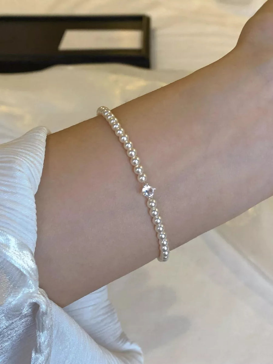 Synthetic Pearl,Alloy,Zircon Care instructions: Avoid wearing during exercise, a bracelet in silver with fitted silhouette