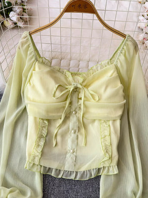 Yellow green ruffled sleeve blouse with bow detail and pearl buttons