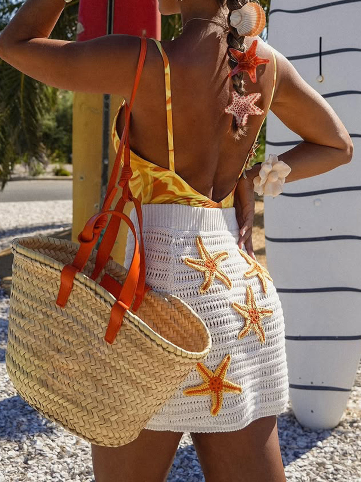White crochet mini skirt with orange starfish embellishments, acrylic
