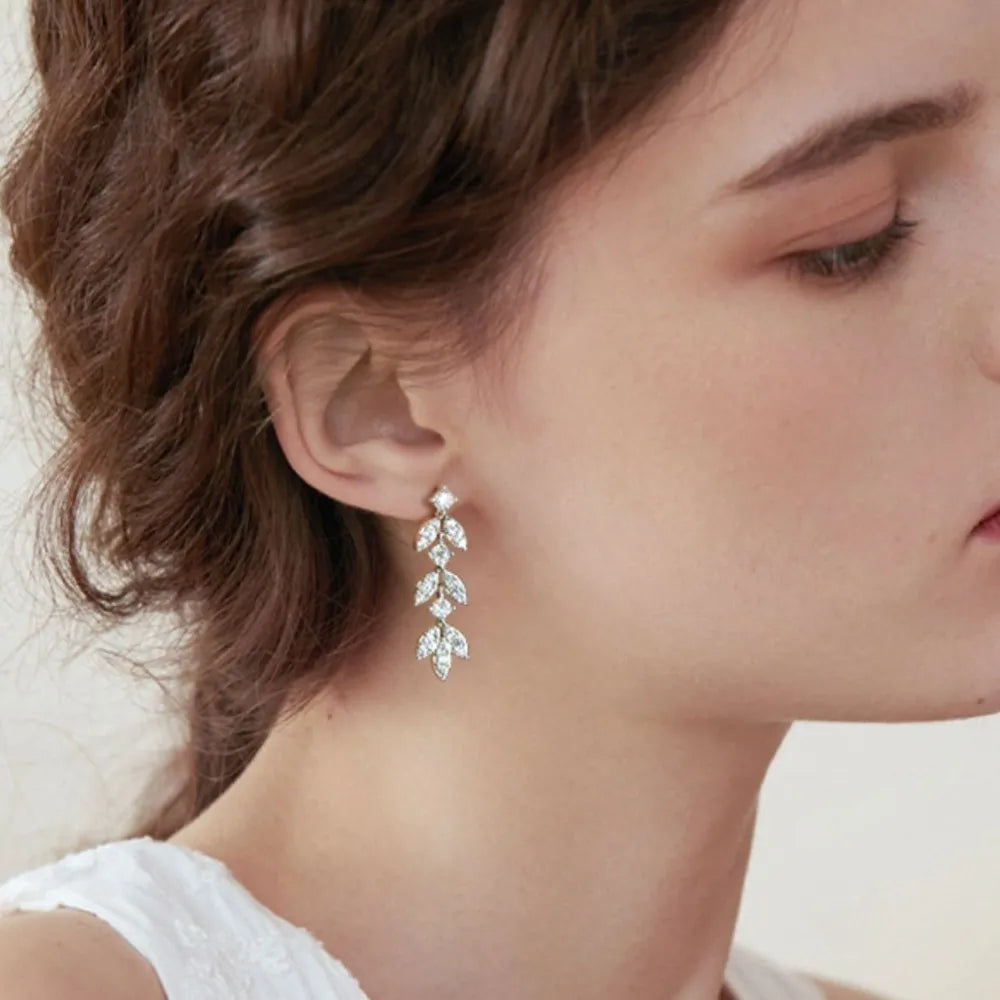 Silver cubic zirconia botanical drop earrings with leaf design
