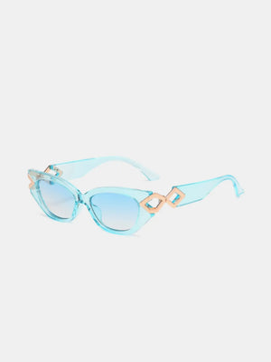 Mint blue cat-eye sunglasses with gold geometric accents and gradient lenses.