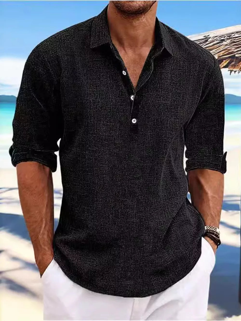 Relaxed fit black half-button casual shirt with a textured fabric and rolled sleeves.