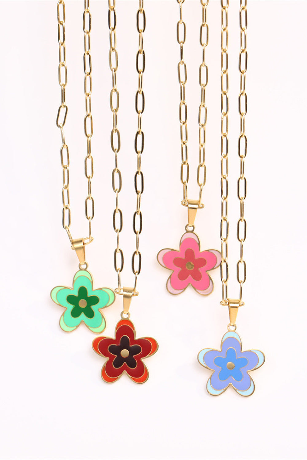 Enamel floral pendant necklaces in green, red, pink, and blue on gold-plated chains.