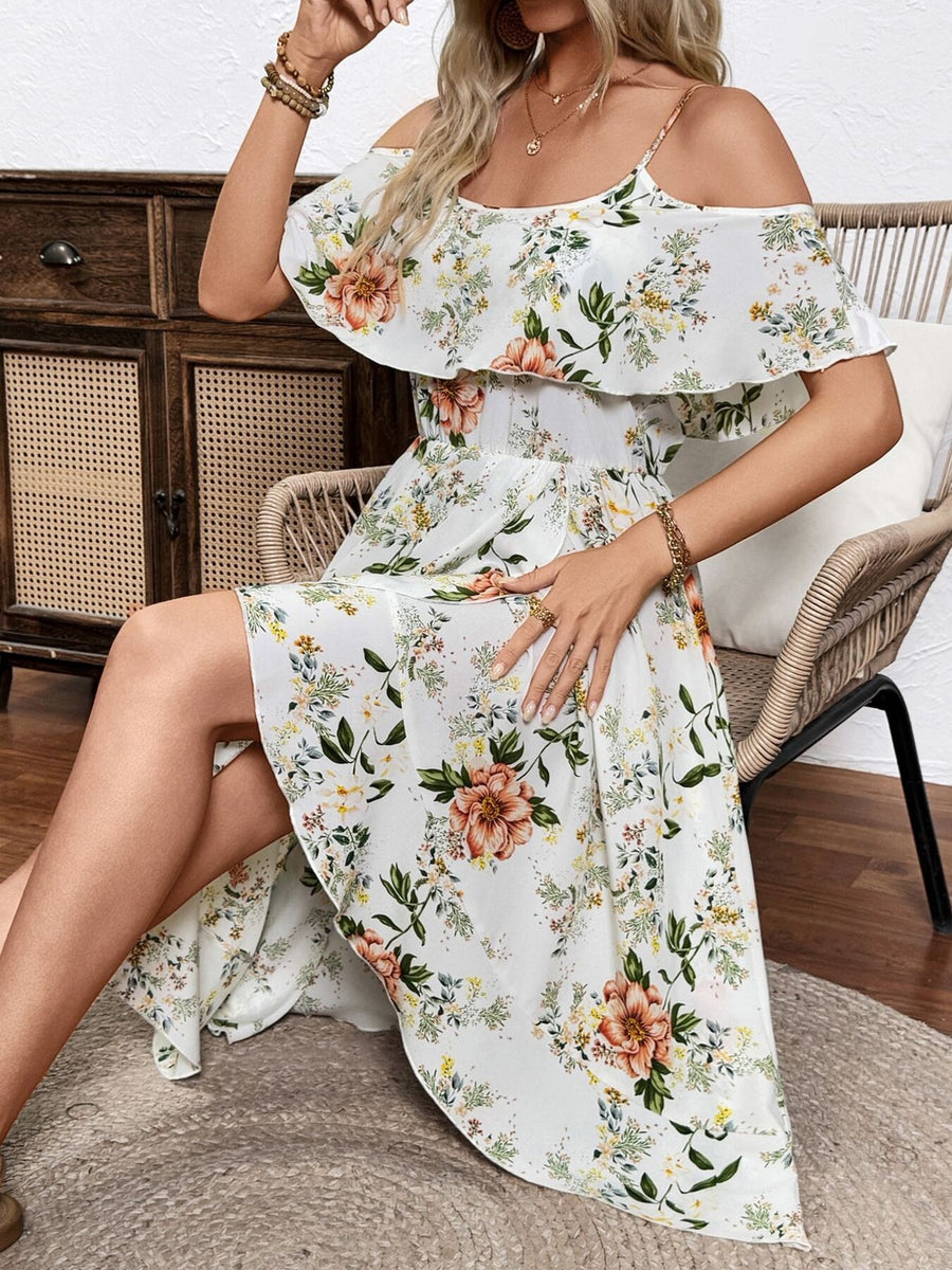 Floral print cold shoulder dress with ruffle trim and spaghetti straps.