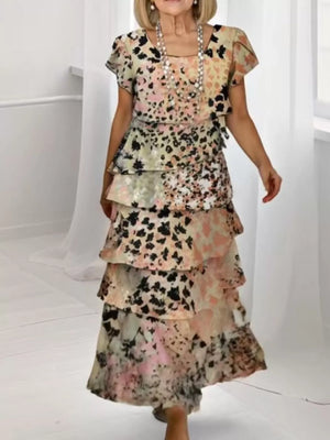 Ruffled tiered maxi dress in multicolor with short sleeves and a floral print.