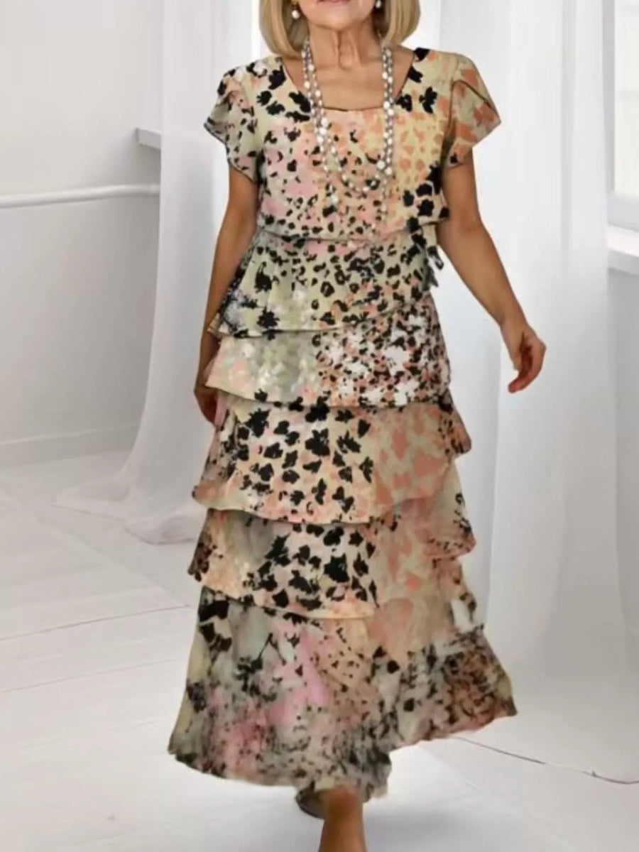 Ruffled tiered maxi dress in multicolor with short sleeves and a floral print.