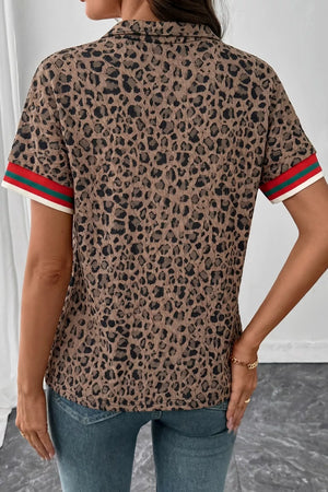 Brown leopard jacquard shirt with striped trim on sleeves.