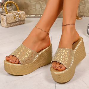 Gold leopard print platform sandals with open toe and wedge heel.