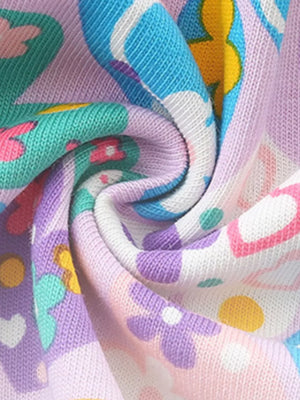 Baby dress with whimsical butterfly and heart print in pastel colors, cotton fabric.
