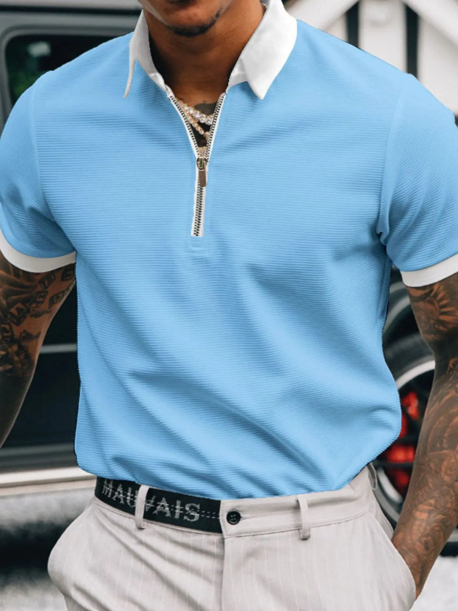 Pastel blue textured zip-neck polo with white collar and cuffs.