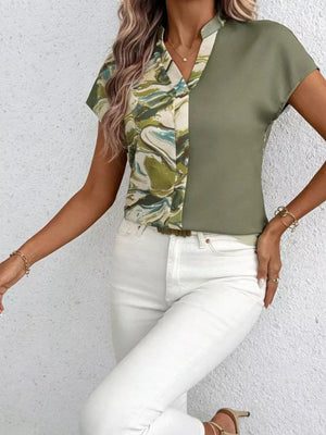 Chic V-neck shirt with color block pattern and short sleeves.