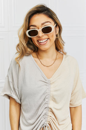 Tortoiseshell oval sunset lenses sunglasses in cream with dark lenses.