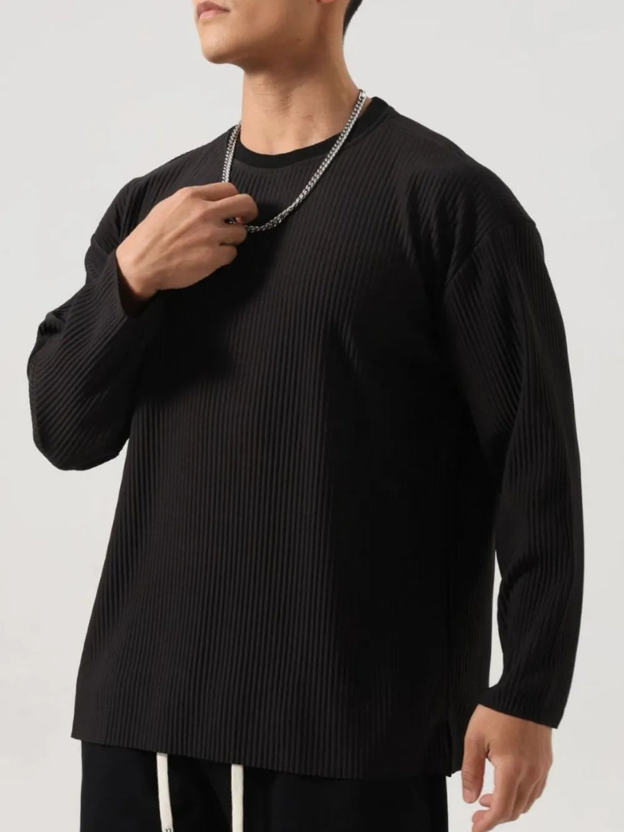 Black textured ribbed oversized long sleeve tee with crew neck.