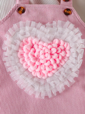 Blush pink corduroy baby dress with white tulle trim and fluffy pink heart applique.