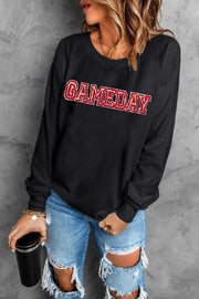 Black crewneck sweatshirt with sequined GAMEDAY appliqué and red trim
