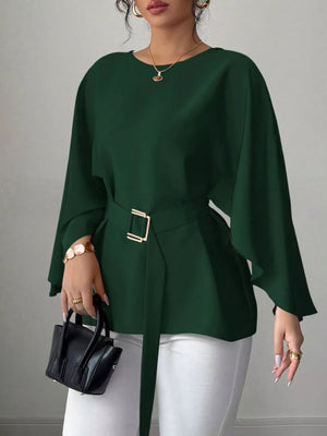 Belted batwing sleeve blouse in olive green with gold buckle detail.