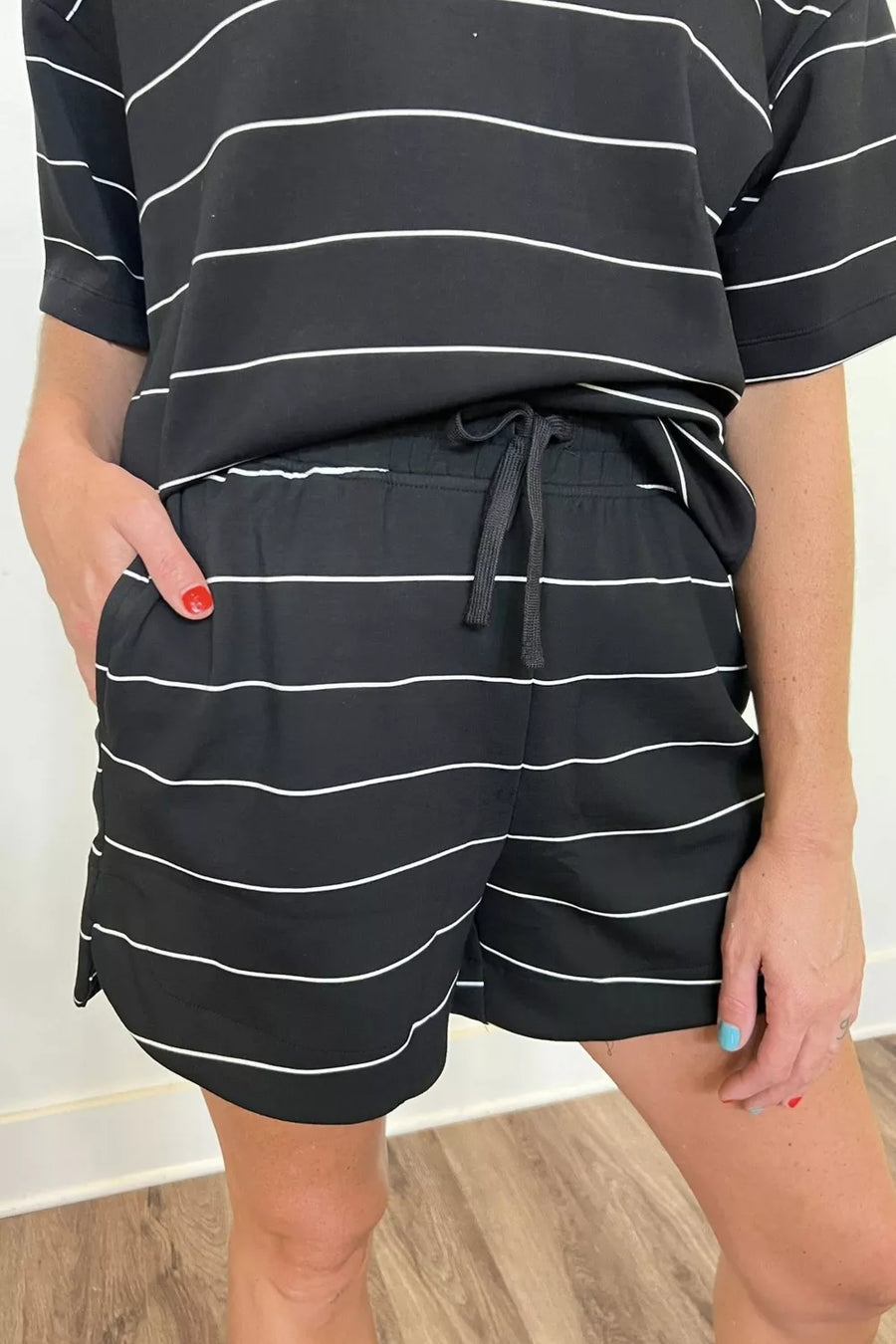 Black and white striped shorts with drawstring waist and side pockets