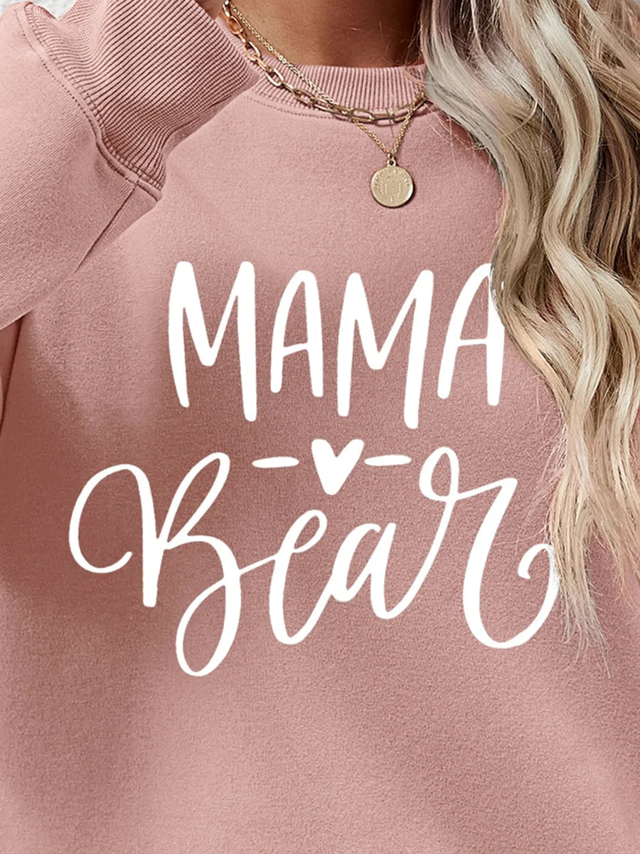 Blush Pink Mama Bear graphic sweatshirt with crewneck and ribbed cuffs.