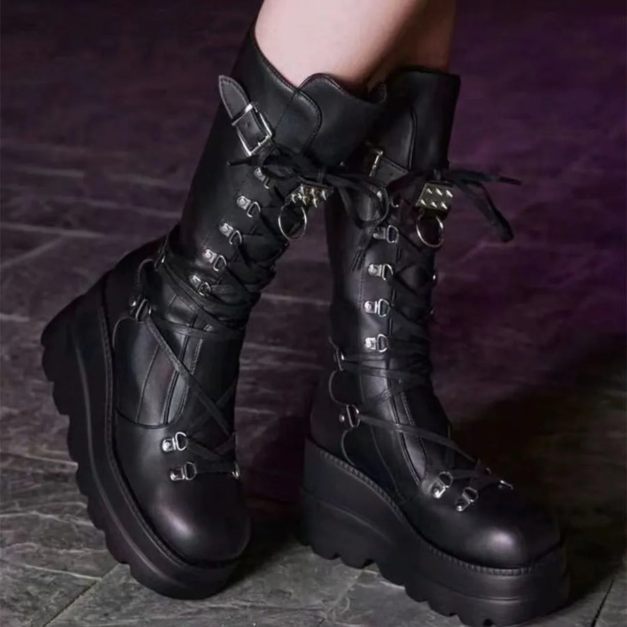 Black platform lace-up combat boots with buckle and ring details.
