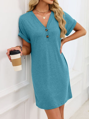 Blue-green t-shirt dress with V-neck, decorative buttons, and cuffed short sleeves.