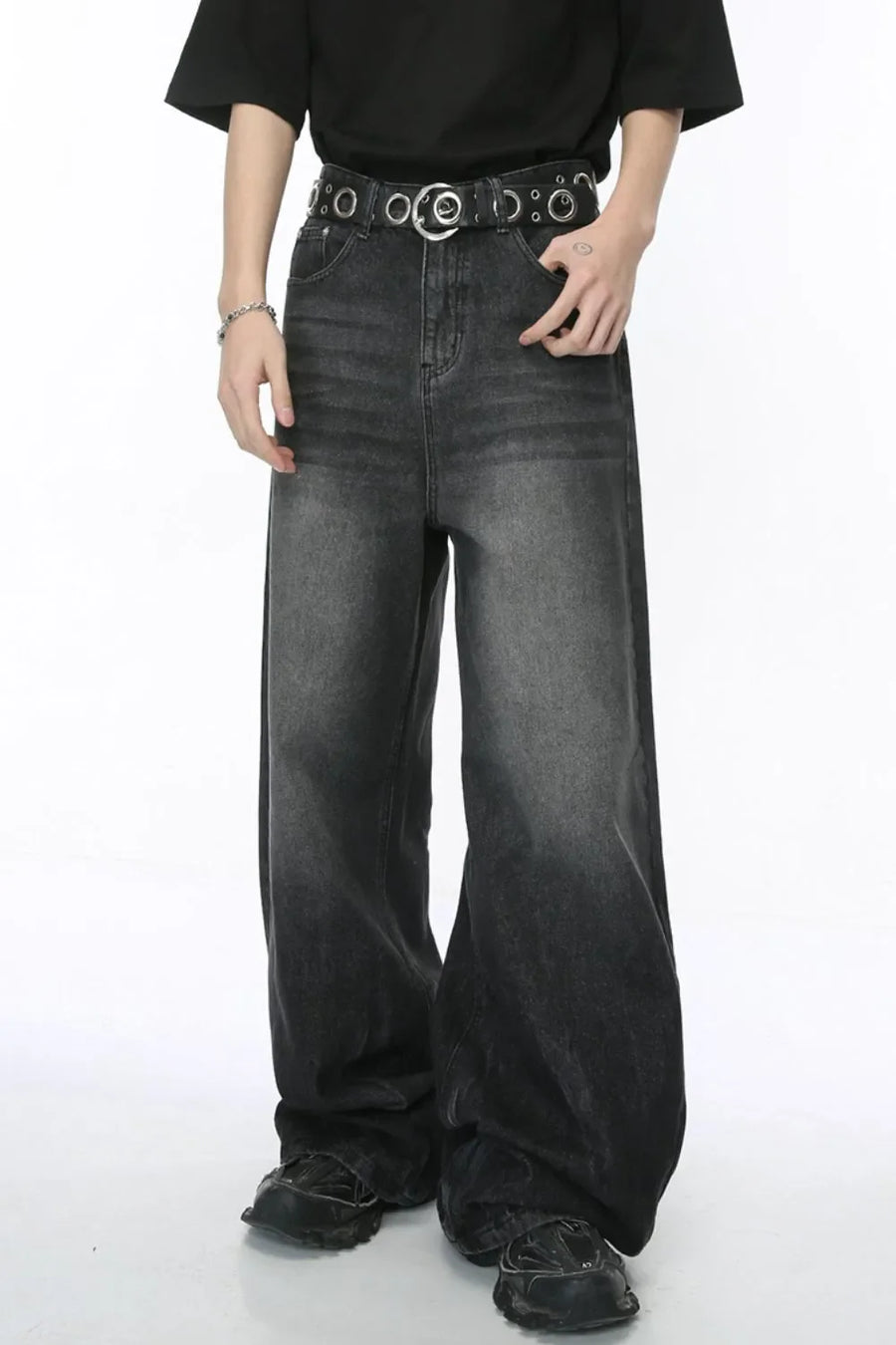 Oversized dark wash denim palazzo trousers with a wide leg and a distressed ombre effect.