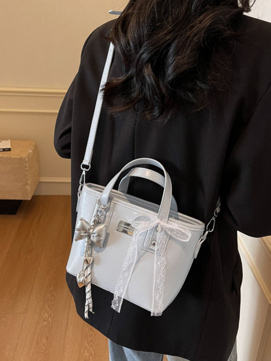 light gray crossbody bag with small and zip