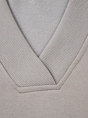 Gray V-neck sweatshirt with ribbed trim detail