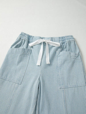 Light blue striped cotton blend jeans with drawstring waist and patch pockets.