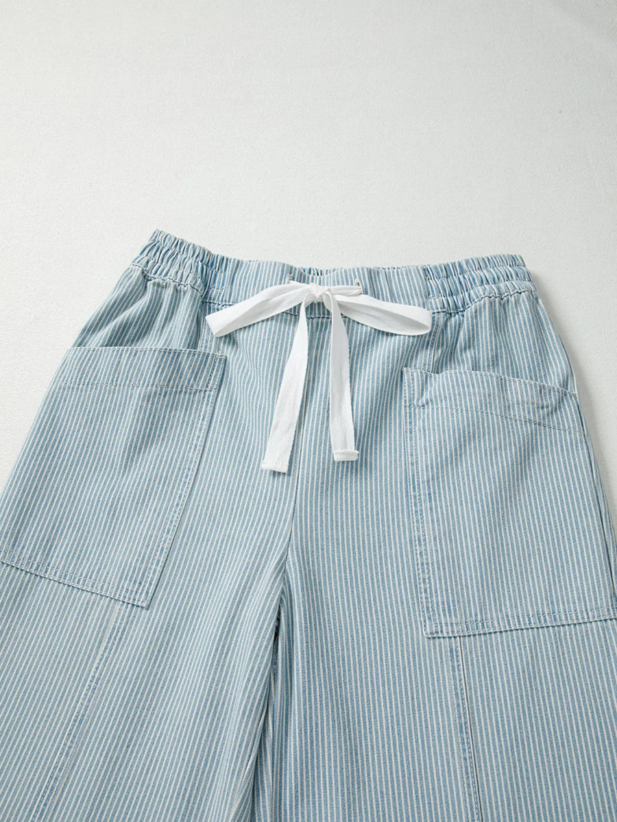 Light blue striped cotton blend jeans with drawstring waist and patch pockets.