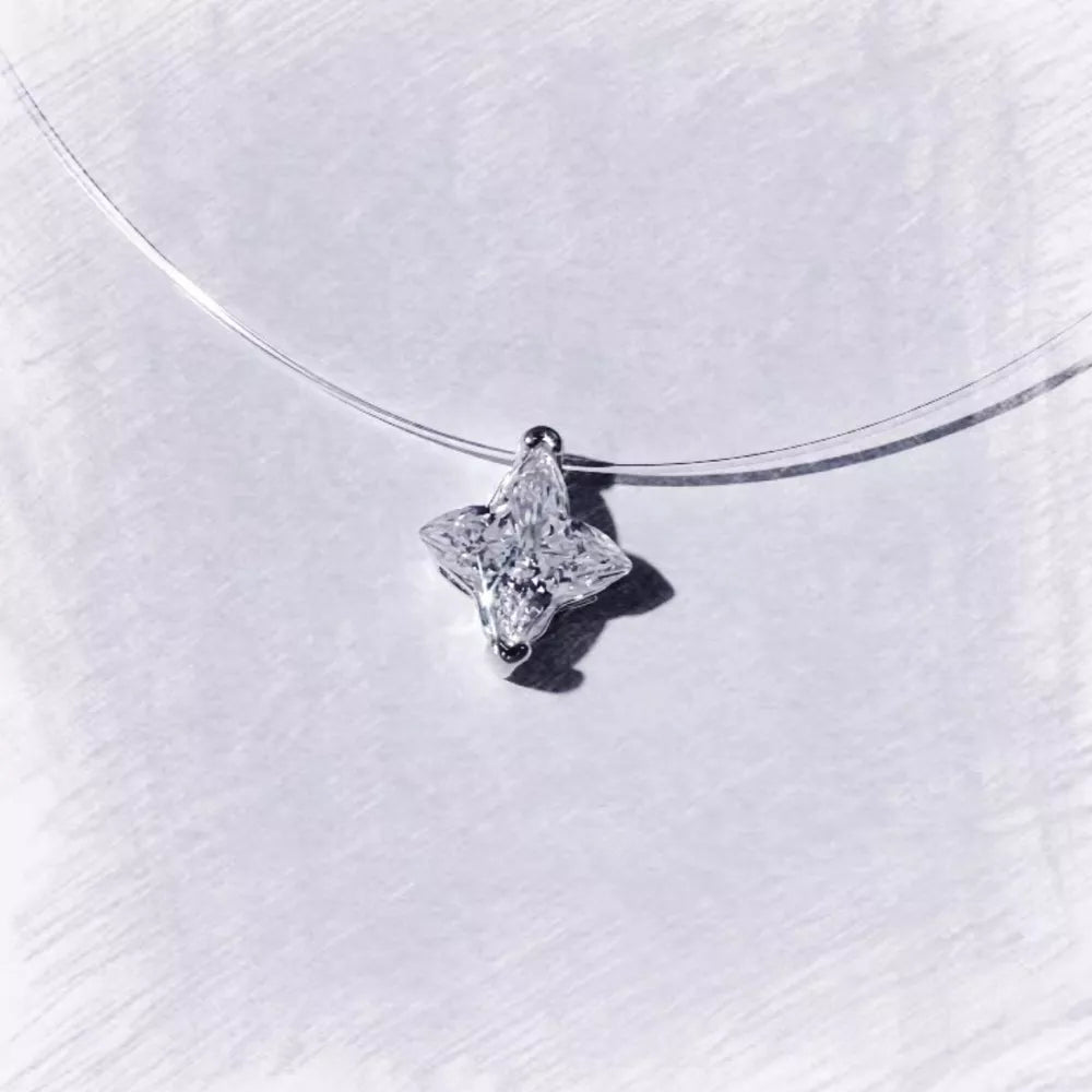 clear necklace featuring star pendant and star