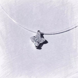 clear necklace featuring star pendant and star