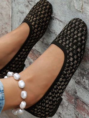 Woven knit square-toe flats in black with a subtle geometric pattern.