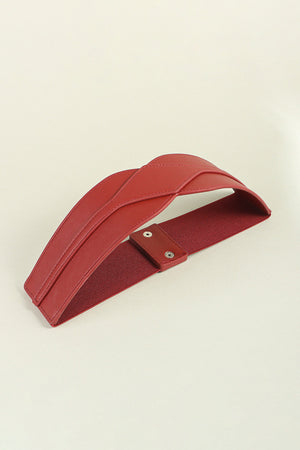 Burgundy elastic belt with sculpted faux leather front and snap closure