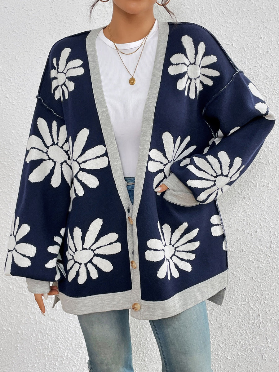 Floral jacquard knit cardigan in dark navy with white daisies and grey trim.