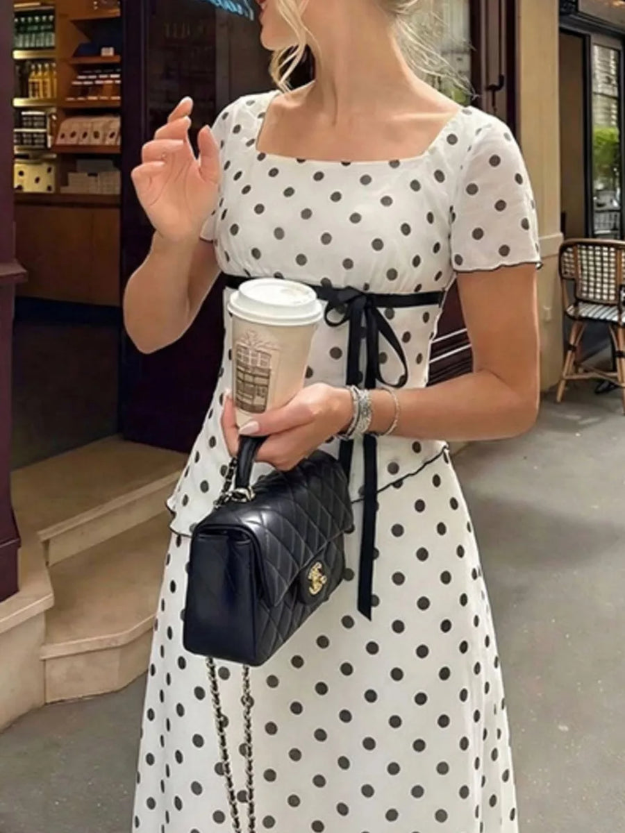 Polka dot square neck top and skirt set with black ribbon detail.