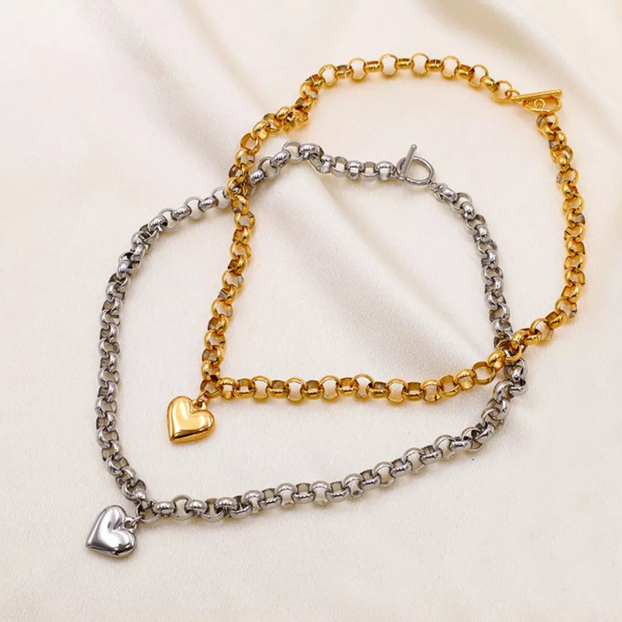 necklace in gold featuring heart pendant and not applicable fit