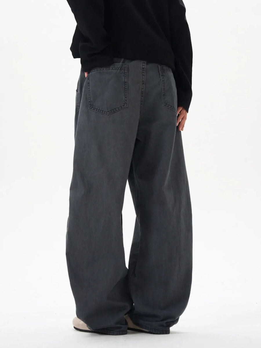 Men's oversized grey cargo pants with a relaxed fit and back pockets.